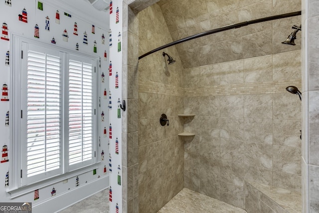 bathroom featuring tiled shower