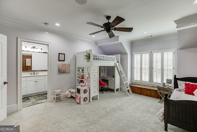 carpeted bedroom with ceiling fan, ornamental molding, connected bathroom, and sink