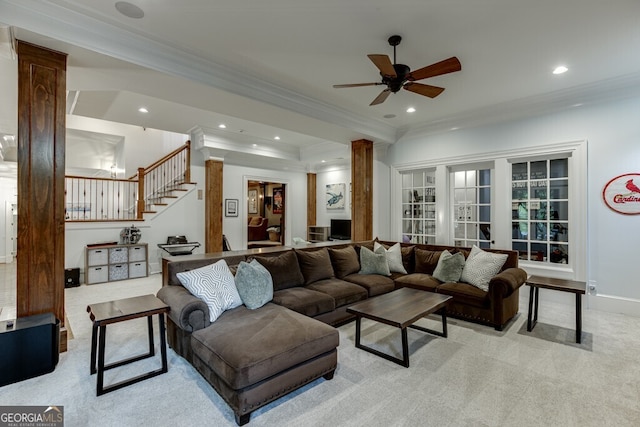 carpeted living room featuring ornate columns, ornamental molding, and ceiling fan