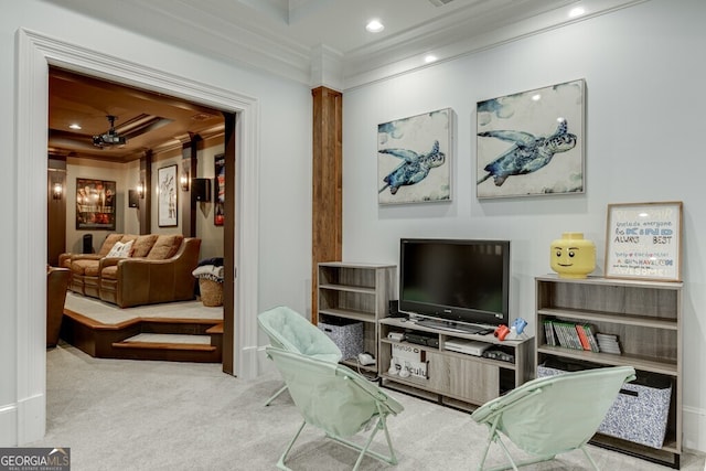 living area with crown molding and light colored carpet