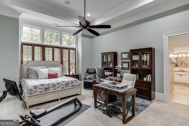 bedroom with ensuite bathroom, ornamental molding, light colored carpet, and ceiling fan