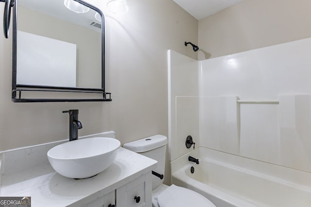 full bathroom with vanity, shower / tub combination, and toilet