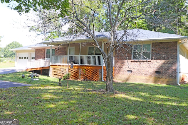 view of front of house with a front yard, a garage, and a porch