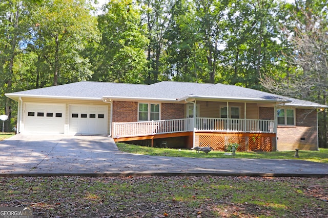 ranch-style house featuring a garage and a porch