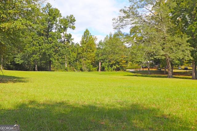 view of home's community featuring a lawn