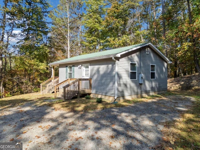 view of side of property featuring a deck