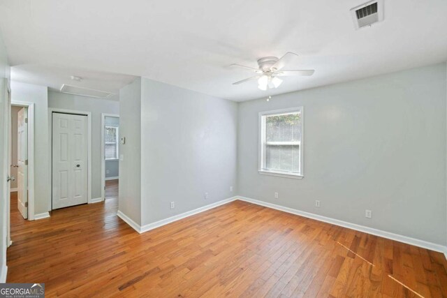 empty room featuring light hardwood / wood-style flooring and ceiling fan