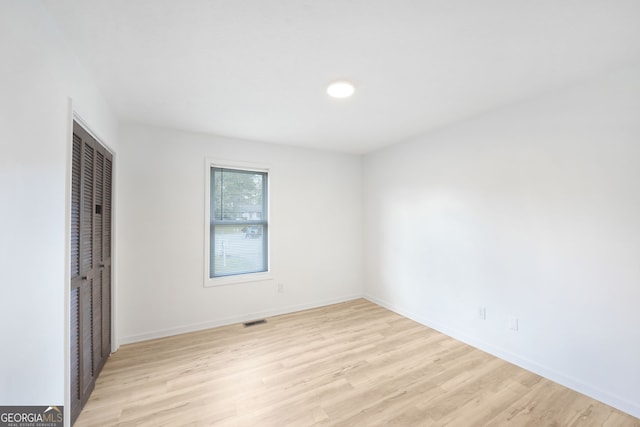 unfurnished room featuring light hardwood / wood-style floors