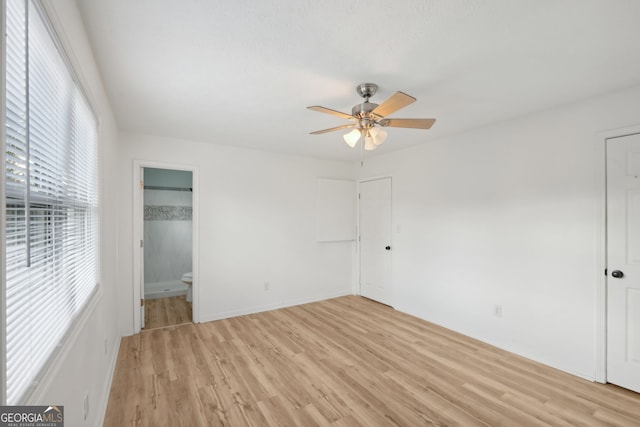 unfurnished bedroom with light wood-type flooring and a ceiling fan