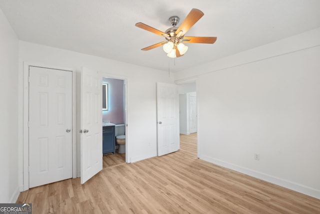 unfurnished bedroom featuring ensuite bathroom, ceiling fan, and light hardwood / wood-style floors