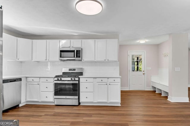 kitchen with white cabinets, stainless steel appliances, and light wood-type flooring