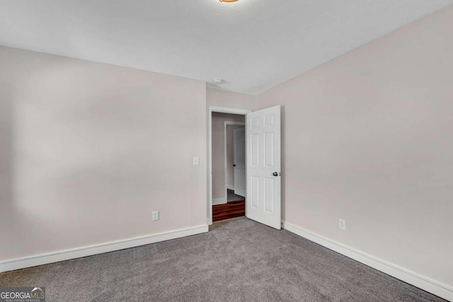 unfurnished room with carpet floors