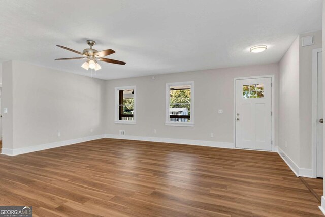 foyer with hardwood / wood-style floors and ceiling fan