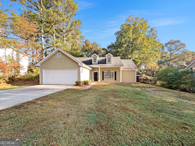 view of front of property featuring a front yard and a garage