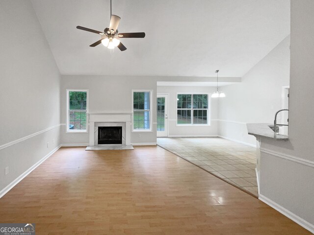 carpeted spare room featuring ceiling fan and a textured ceiling