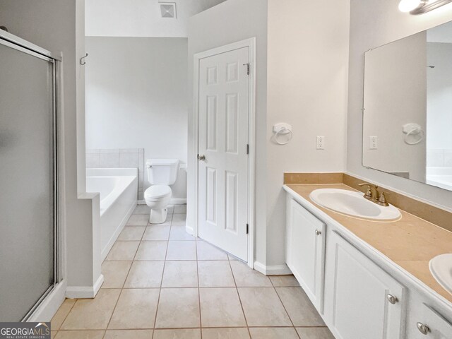 full bathroom with vanity, separate shower and tub, toilet, and tile patterned floors