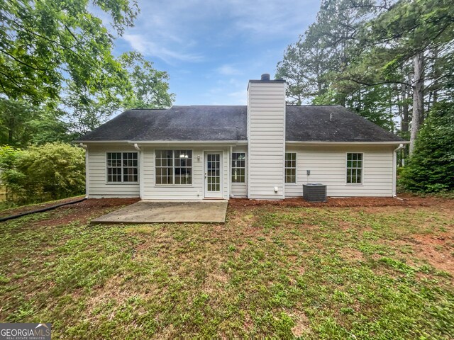 back of house with a yard, a patio area, and central AC unit