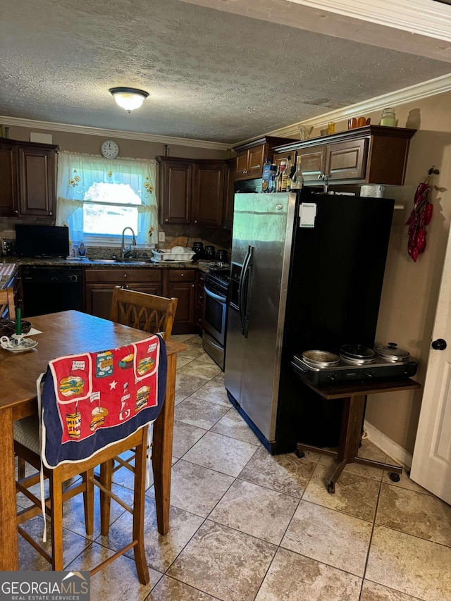 kitchen with crown molding, dark brown cabinetry, black appliances, and sink