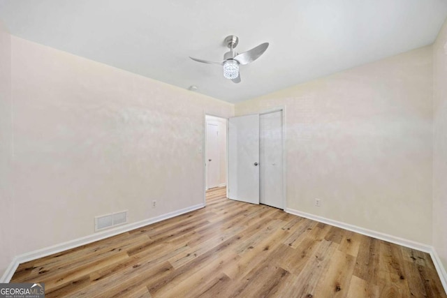 unfurnished bedroom with light hardwood / wood-style floors and ceiling fan