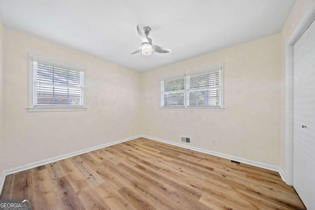 unfurnished room featuring ceiling fan and light wood-type flooring