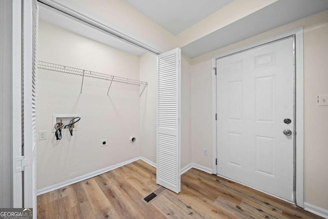 laundry room featuring hookup for an electric dryer, hookup for a washing machine, and light wood-type flooring