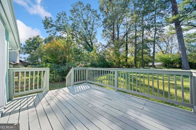 wooden deck with a yard