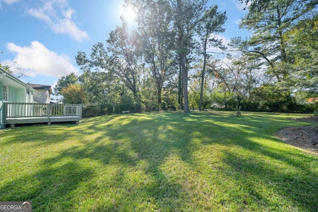 view of yard with a deck