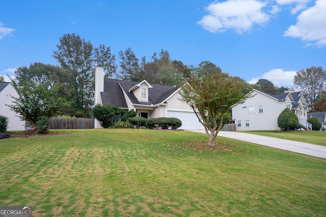 view of front facade with a front yard and a garage