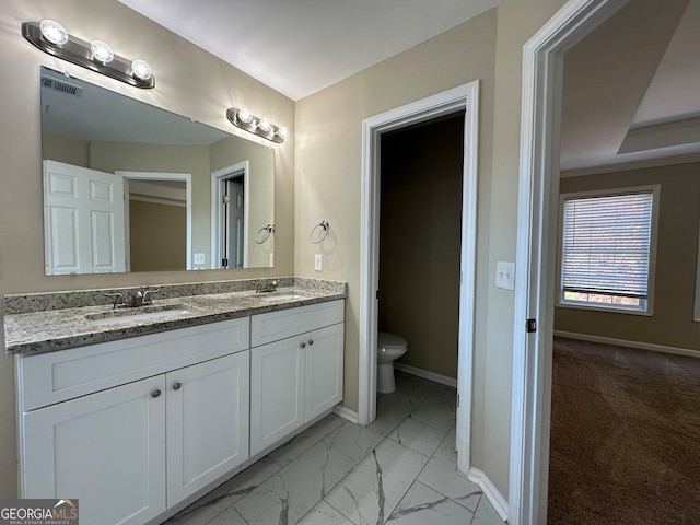 bathroom with vanity and toilet