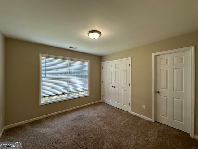 unfurnished bedroom with carpet