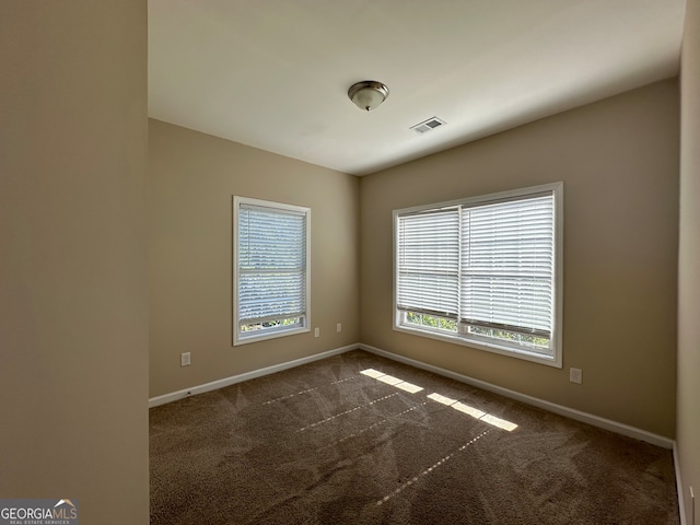 view of carpeted spare room