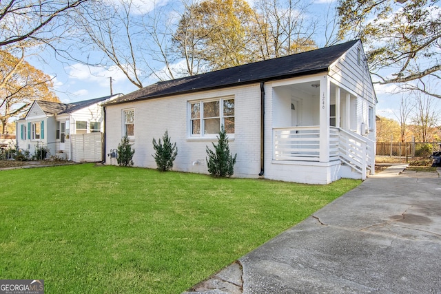 view of front of house with a front lawn and a porch