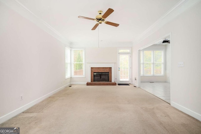 unfurnished living room with crown molding, light colored carpet, and ceiling fan