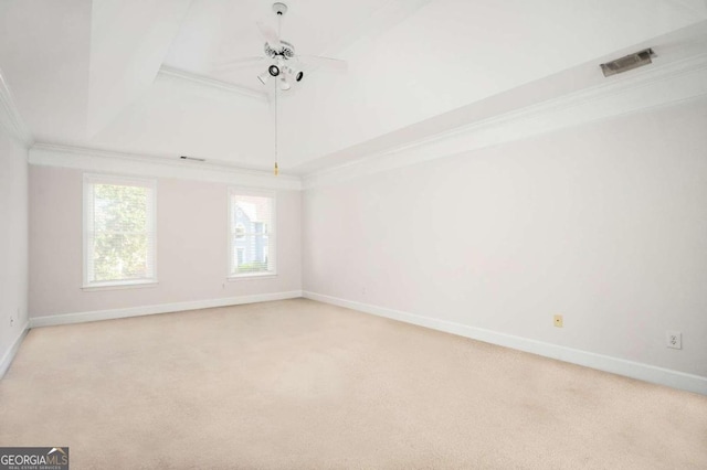 carpeted empty room featuring ornamental molding and ceiling fan