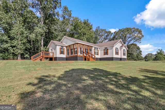 exterior space featuring a lawn and a wooden deck