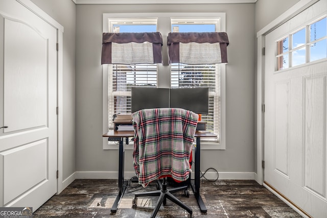 dining space featuring plenty of natural light and dark hardwood / wood-style flooring