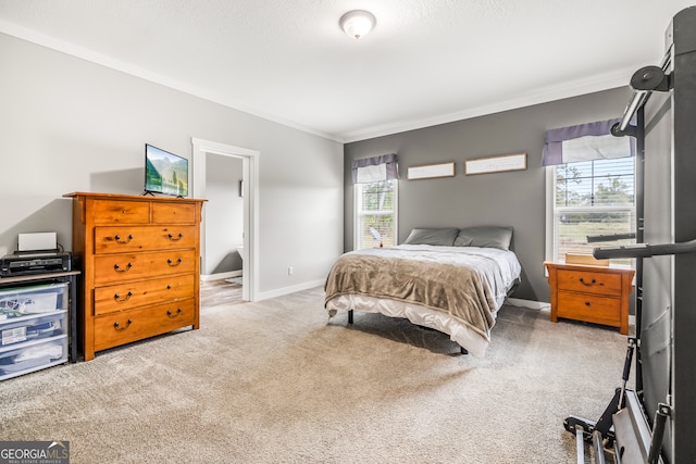 bedroom with light carpet and ornamental molding