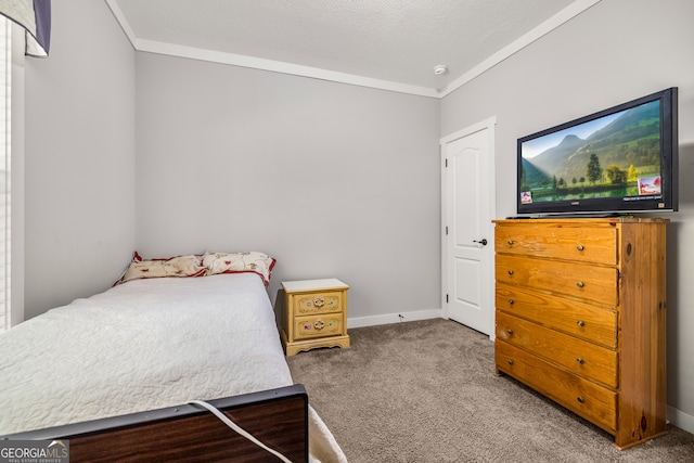 carpeted bedroom featuring a textured ceiling and crown molding