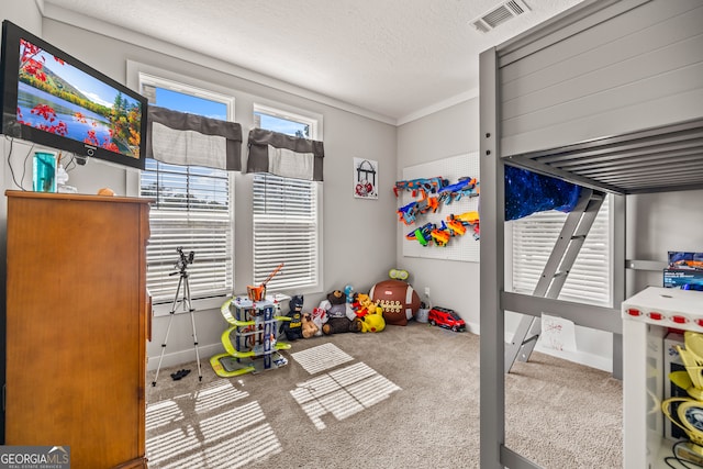 carpeted bedroom featuring a textured ceiling and ornamental molding