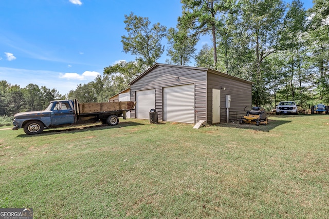 garage featuring a yard