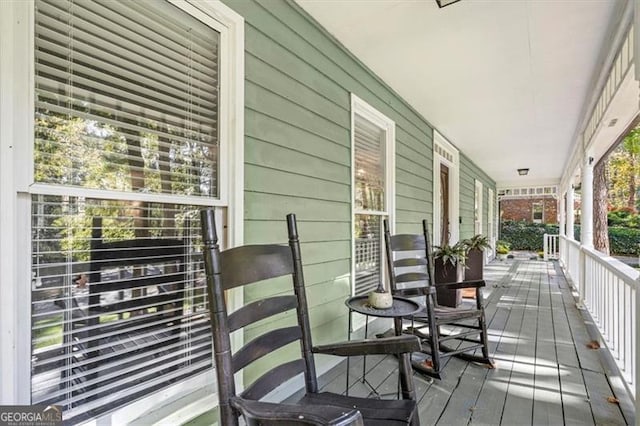 wooden deck featuring a porch