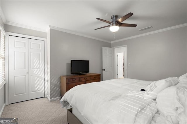 bedroom featuring light carpet, ceiling fan, and crown molding