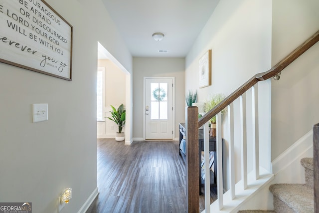 foyer entrance with dark wood-type flooring