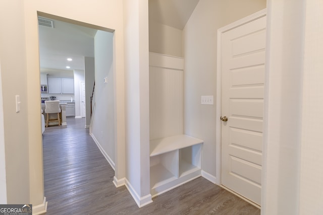 corridor with hardwood / wood-style floors