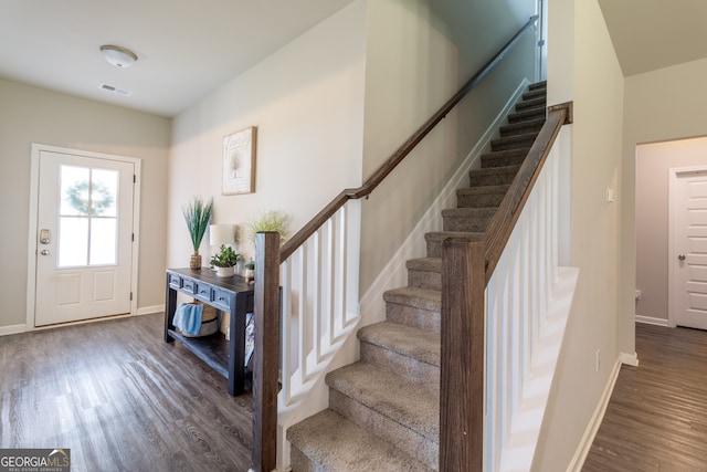 entrance foyer with dark hardwood / wood-style flooring