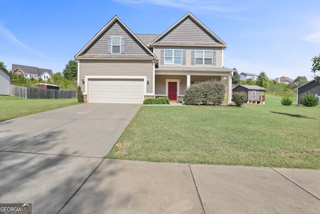 view of front of property featuring a front lawn and a garage