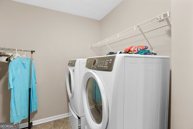 washroom with washing machine and dryer