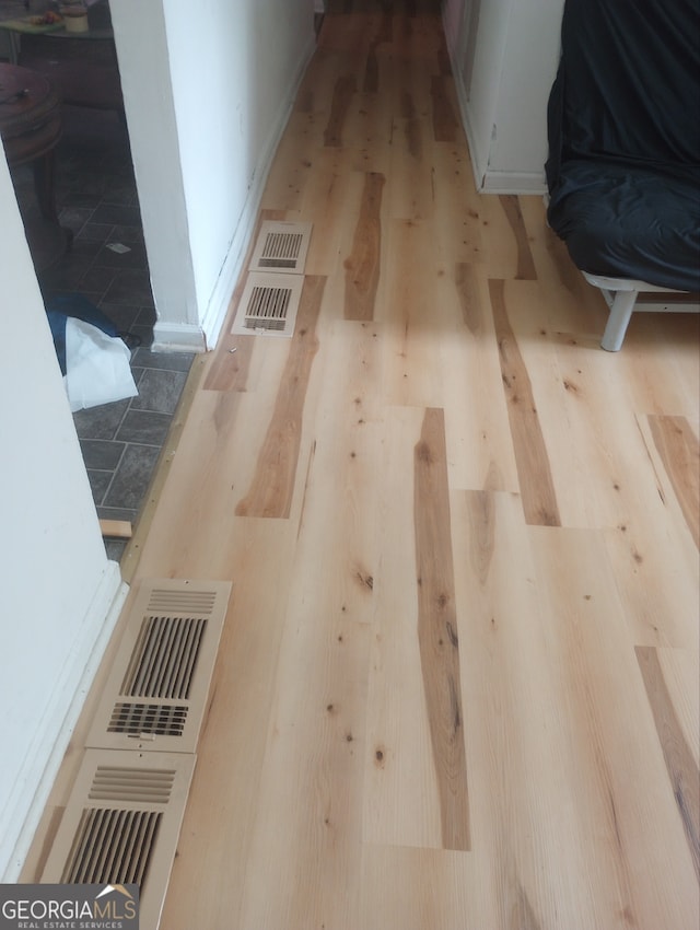 interior details featuring wood-type flooring