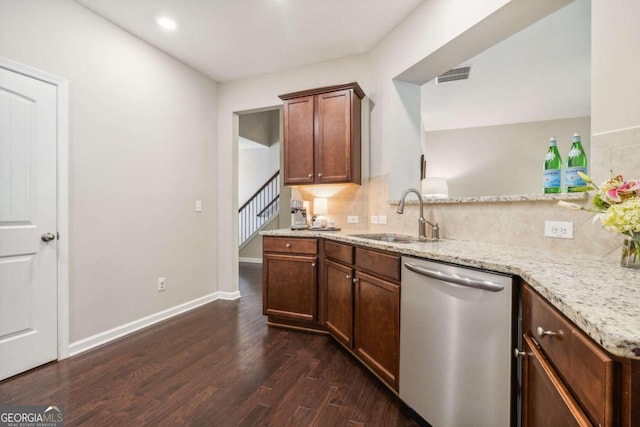 kitchen featuring dishwasher, dark hardwood / wood-style floors, decorative backsplash, and sink