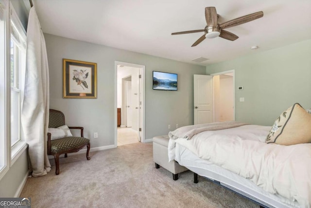 bedroom with ceiling fan and light colored carpet